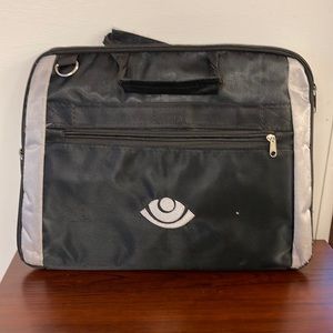 Black computer bag with eye symbol